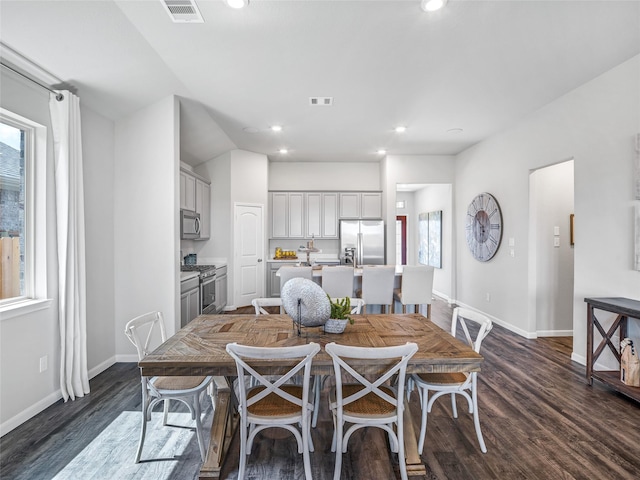 dining area featuring baseboards, visible vents, dark wood-style flooring, and recessed lighting