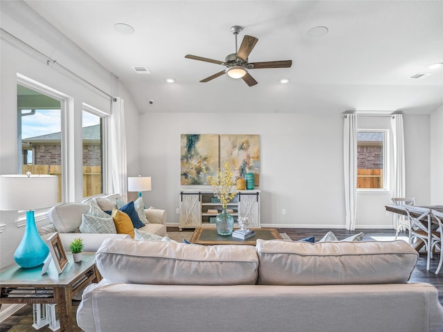 living room featuring ceiling fan, recessed lighting, plenty of natural light, and baseboards