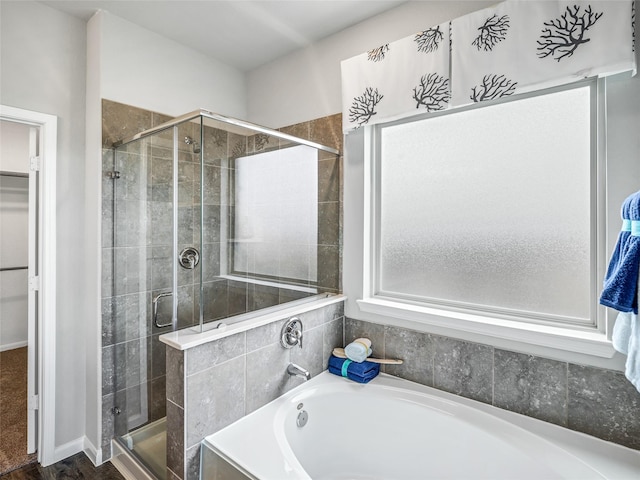 27014 Costa Creek Dr, Katy, TX 77493 - bathroom featuring a shower stall, a garden tub, and a spacious closet