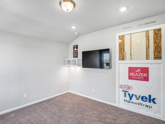 interior space featuring baseboards, vaulted ceiling, carpet flooring, and recessed lighting