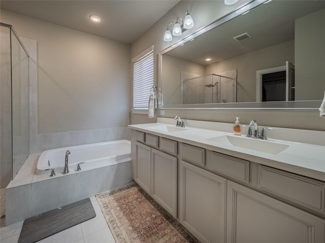 bathroom with vanity, tile patterned floors, and independent shower and bath