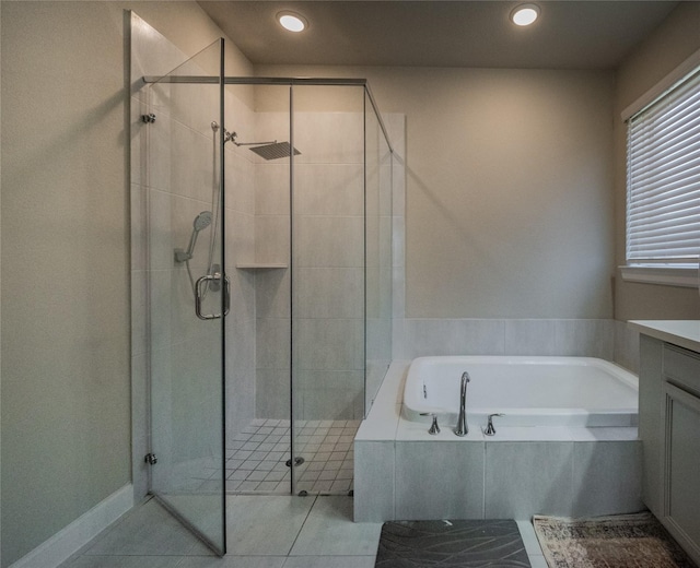 bathroom with vanity, shower with separate bathtub, and tile patterned flooring