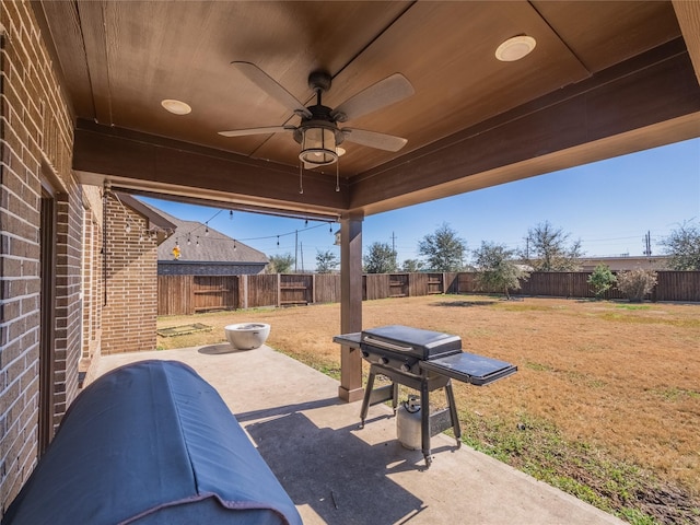 view of patio / terrace with ceiling fan and area for grilling