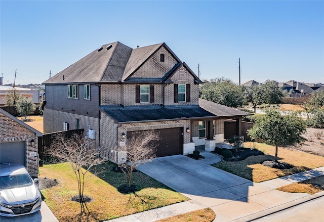 view of property featuring a garage and a front lawn