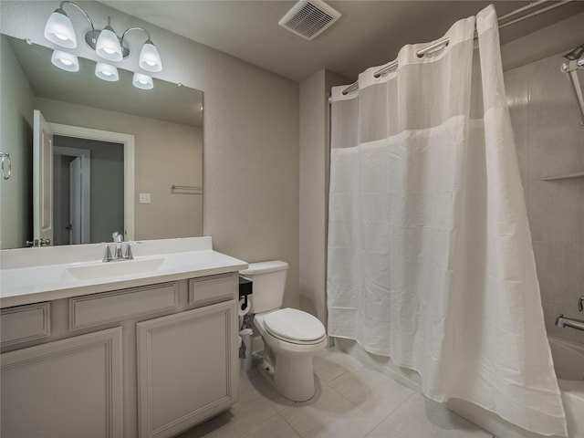 full bathroom with tile patterned floors, toilet, shower / bath combo with shower curtain, and vanity