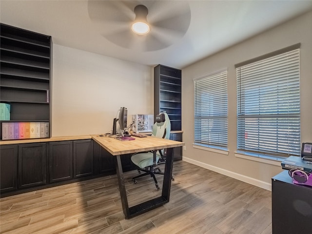 office space with ceiling fan and light hardwood / wood-style flooring