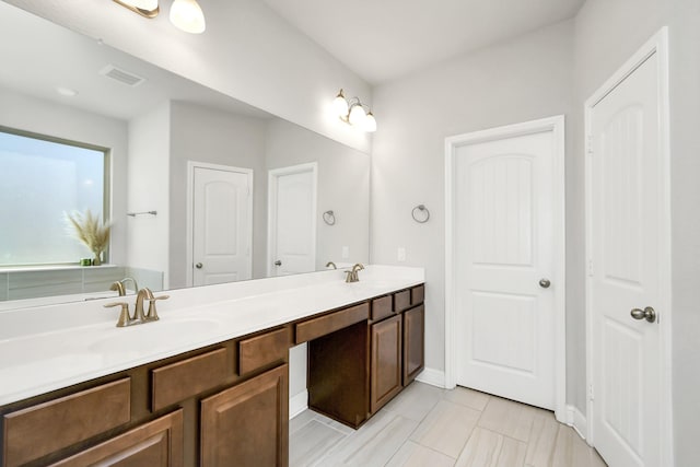 bathroom with tile patterned flooring and vanity