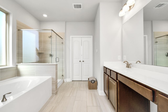 bathroom with vanity and plus walk in shower