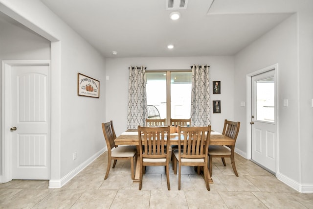 dining space with light tile patterned floors