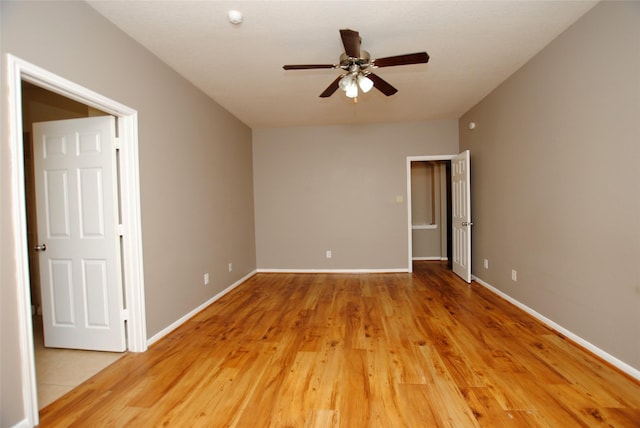 unfurnished room featuring ceiling fan and light hardwood / wood-style floors