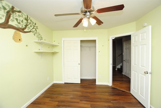 unfurnished bedroom featuring dark hardwood / wood-style flooring, a closet, and ceiling fan