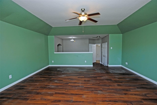 unfurnished living room featuring dark hardwood / wood-style floors and ceiling fan