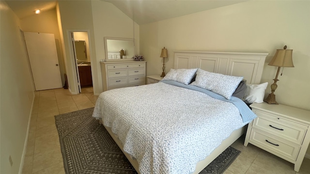 bedroom featuring vaulted ceiling and light tile patterned flooring