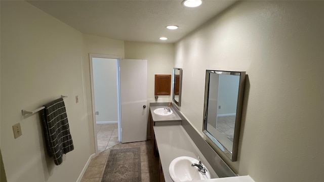 bathroom featuring tile patterned flooring, vanity, and recessed lighting