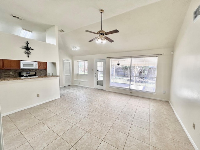 unfurnished living room with light tile patterned floors, ceiling fan, visible vents, and vaulted ceiling