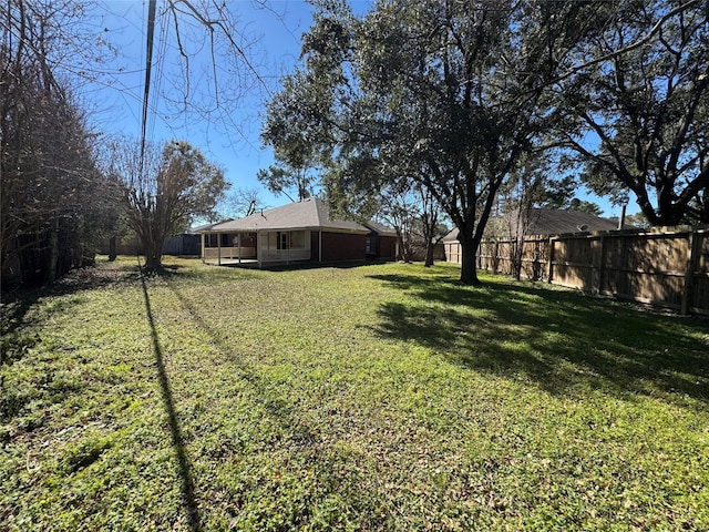 view of yard with a fenced backyard