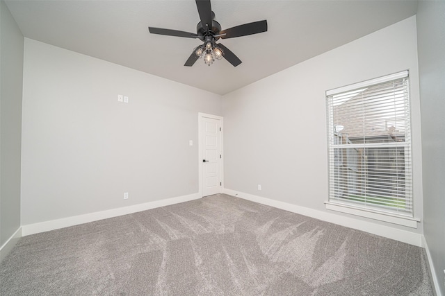 carpeted empty room with ceiling fan