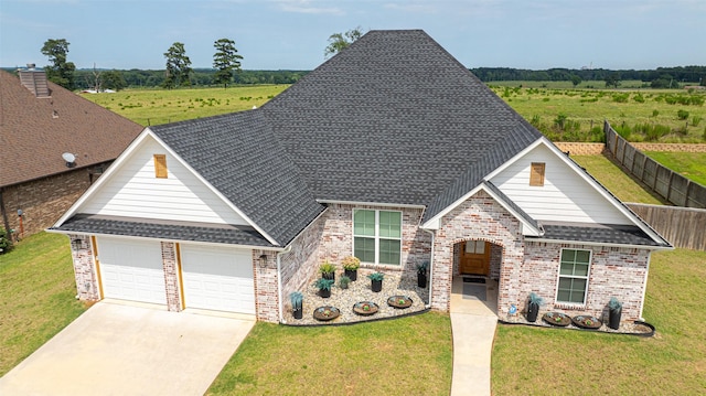 view of front facade featuring a garage and a front lawn