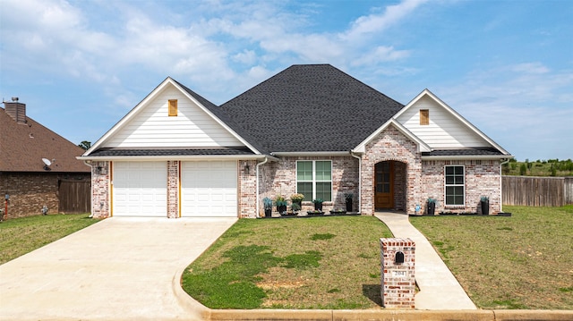 view of front facade featuring a garage and a front lawn