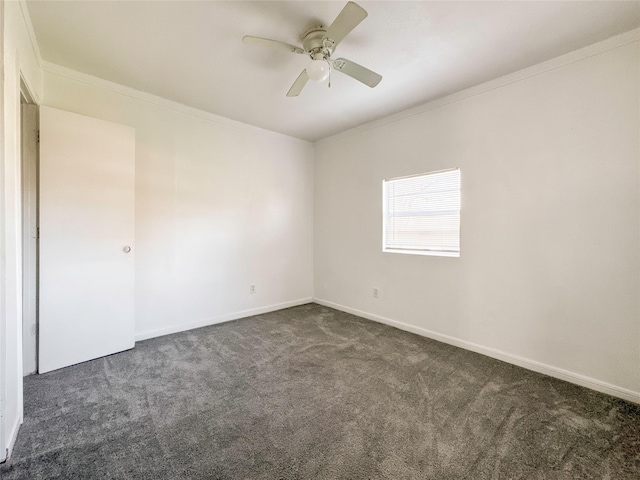 carpeted spare room with crown molding and ceiling fan