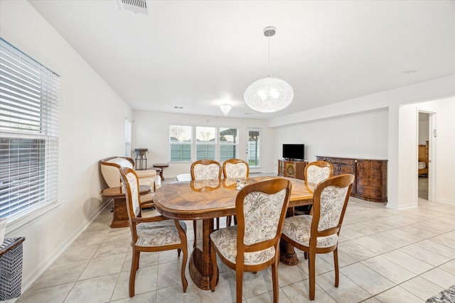 dining room with light tile patterned flooring