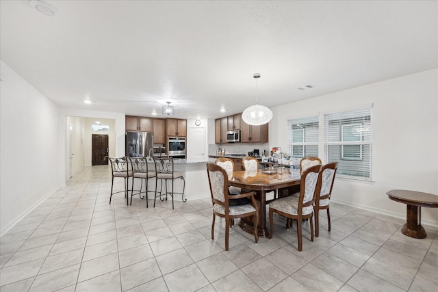 dining area with light tile patterned floors