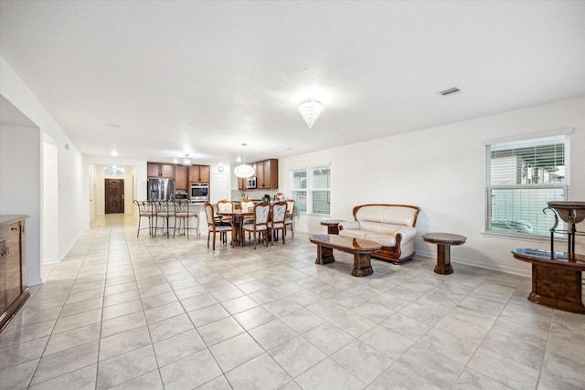 interior space with a wealth of natural light and light tile patterned floors