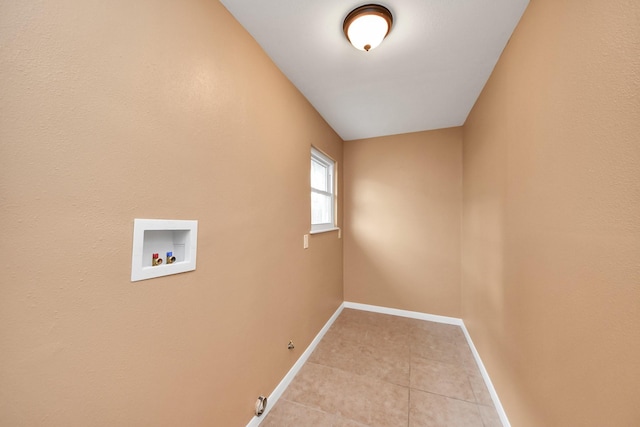 laundry area featuring hookup for a washing machine, gas dryer hookup, and light tile patterned floors