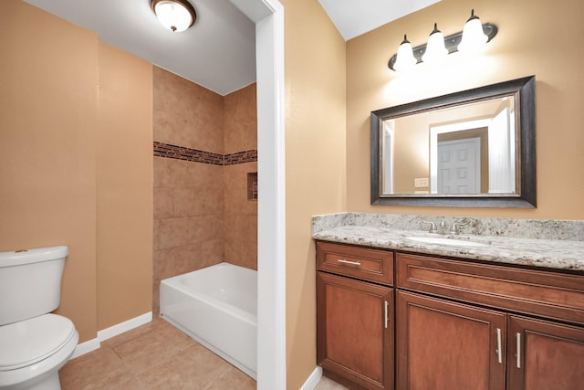 full bathroom with vanity, tiled shower / bath, tile patterned floors, and toilet