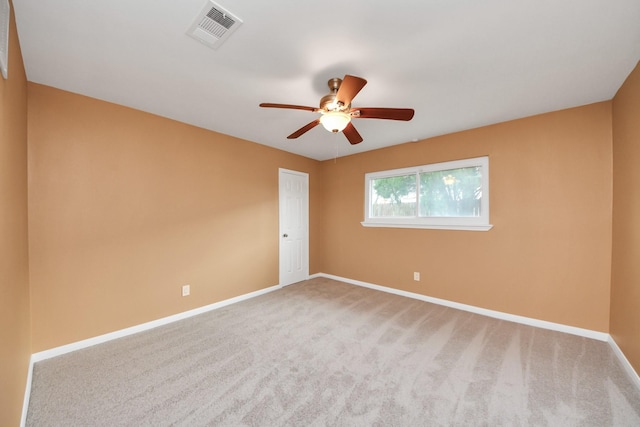 unfurnished room with ceiling fan and carpet flooring