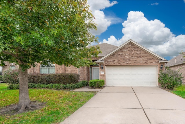 view of front of property featuring a garage, brick siding, roof with shingles, and driveway