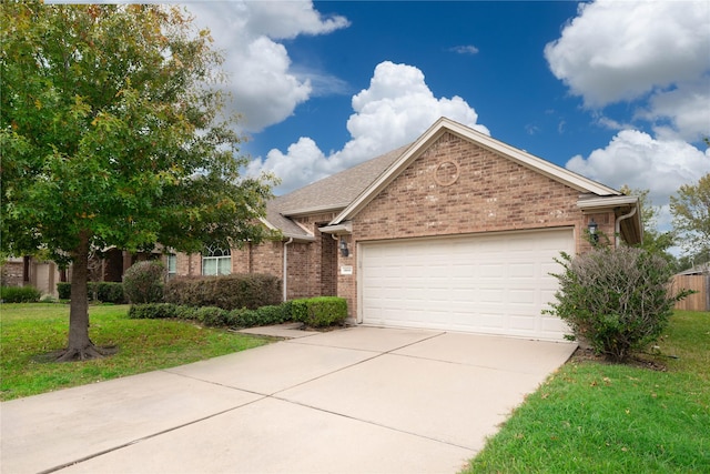 view of front facade with a garage and a front yard