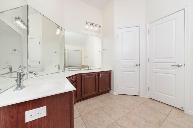 bathroom featuring vanity and tile patterned flooring