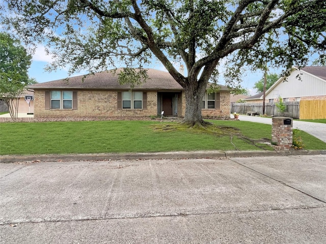 ranch-style house with a front lawn