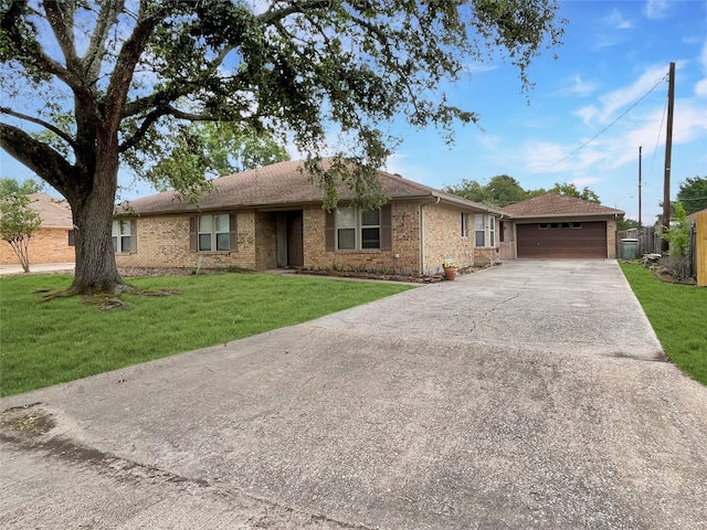 ranch-style house featuring a garage and a front yard