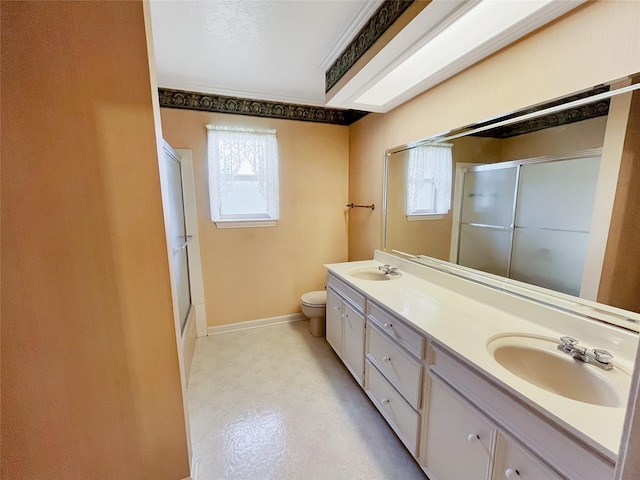 full bathroom featuring vanity, enclosed tub / shower combo, and toilet