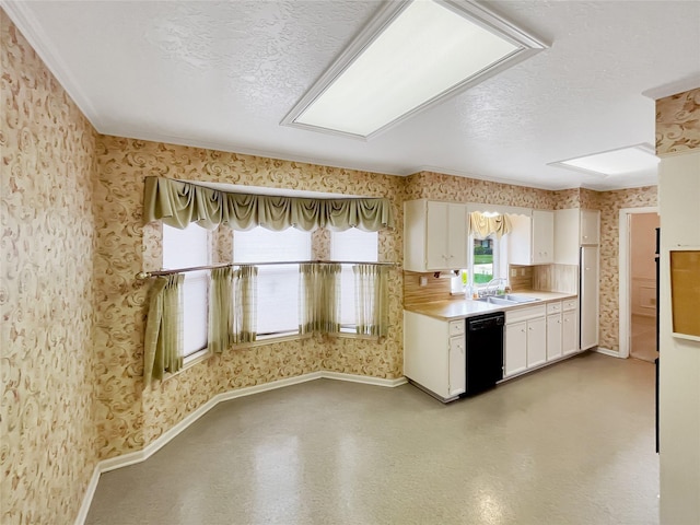 kitchen with dishwasher, sink, a textured ceiling, and white cabinets