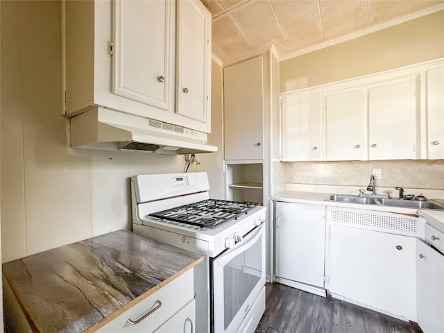 kitchen featuring white gas range, sink, white cabinets, and dark hardwood / wood-style flooring