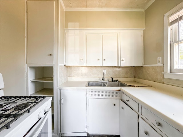 kitchen featuring white cabinetry, white range with gas cooktop, sink, and ornamental molding