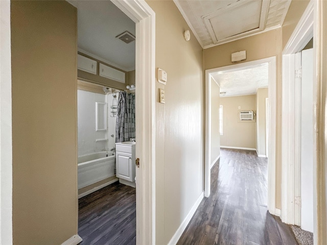 hall with a wall mounted AC and dark hardwood / wood-style flooring