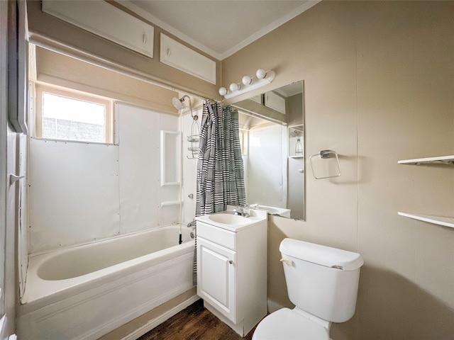 full bathroom with hardwood / wood-style flooring, shower / bath combo, vanity, and toilet