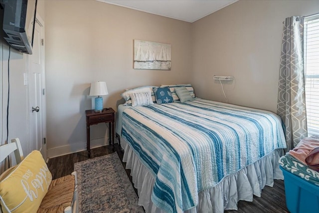 bedroom with dark wood-type flooring