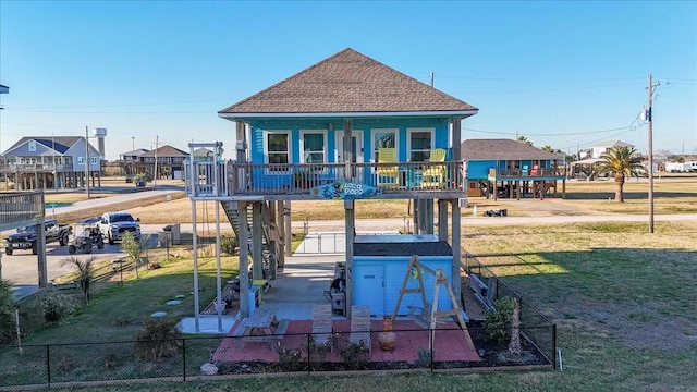 exterior space featuring a porch and a lawn