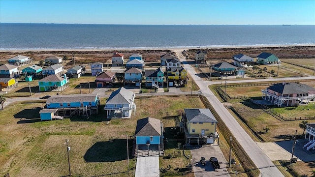 aerial view with a view of the beach and a water view