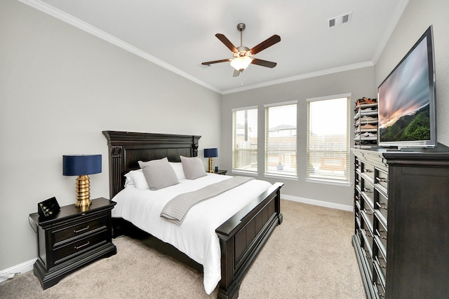 carpeted bedroom featuring ornamental molding and ceiling fan