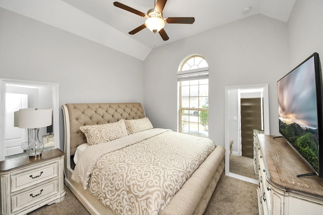 carpeted bedroom with ceiling fan and vaulted ceiling