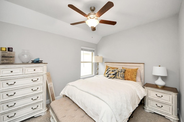 bedroom with lofted ceiling, light carpet, and ceiling fan