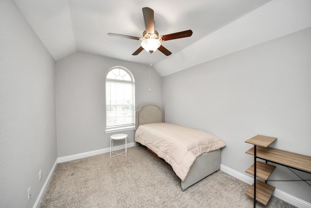 bedroom with light carpet, vaulted ceiling, and ceiling fan