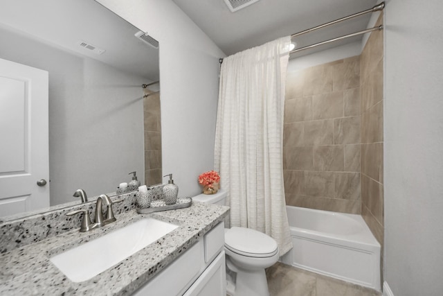 full bathroom featuring tile patterned flooring, shower / bath combo, vanity, and toilet