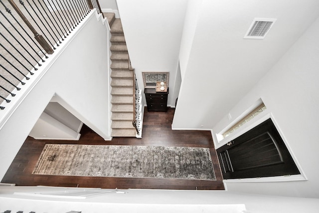 stairway featuring hardwood / wood-style floors